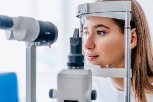 Optometrists measuring someone's eyes