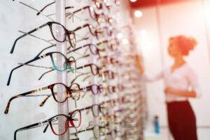 glasses racking with woman inspecting